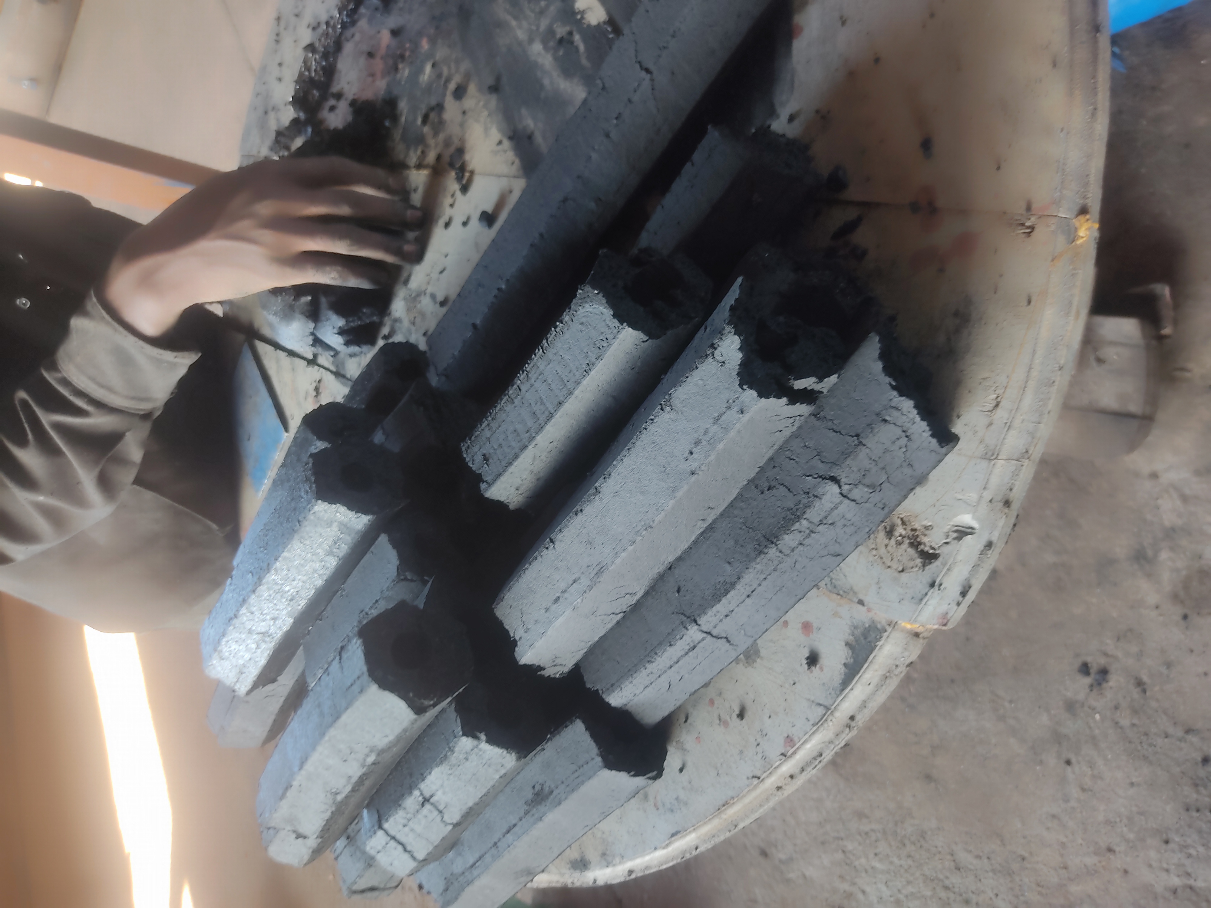 Eco-friendly briquettes made from compressed carbonised sawdust