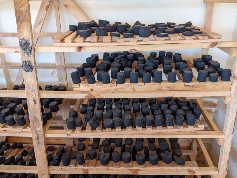 Family using clean cooking energy from woodgas